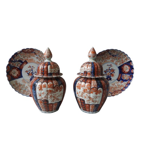 440 - A PAIR OF 19TH CENTURY IMARI COVERED VASES AND TWO DISHES, the lobed baluster vases with lids, 32 cm... 