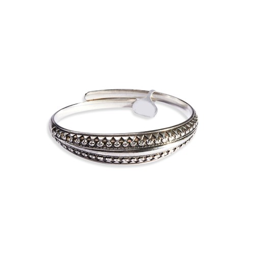 168 - A SILVER BANGLE BY DAVID ANDERSEN of torque design, the upper domed section of geometric pattern. Ma... 