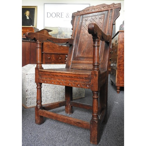 559 - A CHARLES I CARVED OAK ARMCHAIR, circa 1640