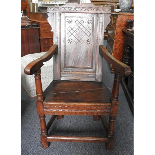 559 - A CHARLES I CARVED OAK ARMCHAIR, circa 1640