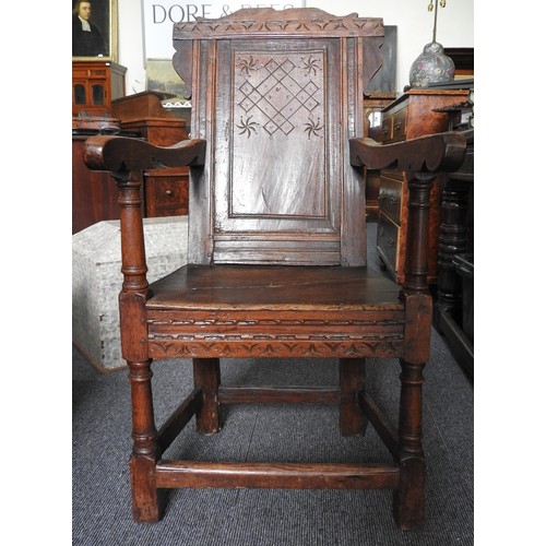 559 - A CHARLES I CARVED OAK ARMCHAIR, circa 1640