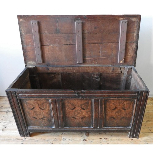 15 - A CHARLES II OAK COFFER, with unusual painted decoration to the three front panels