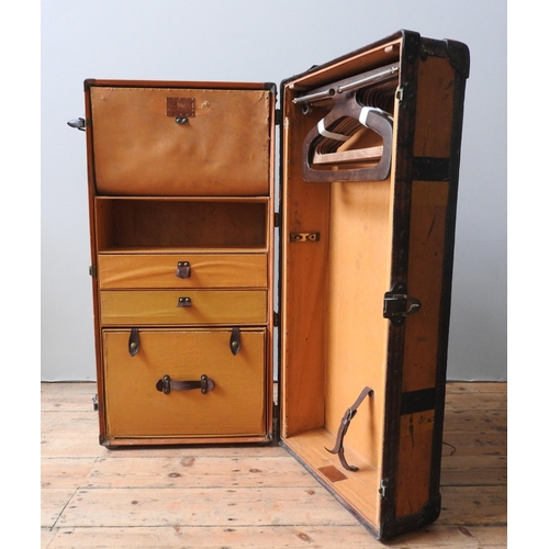 124 - A VINTAGE LOUIS VUITTON ORANGE VUITTONITE WARDROBE TRUNK, canvas with wooden battens, fitted interio... 