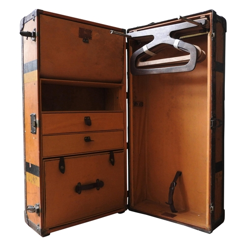A VINTAGE LOUIS VUITTON ORANGE VUITTONITE WARDROBE TRUNK, canvas with wooden battens, fitted interior with drawers on one side and extending hangers on the other, with leather handles and trim, monogrammed RGHT on left and right of the exterior