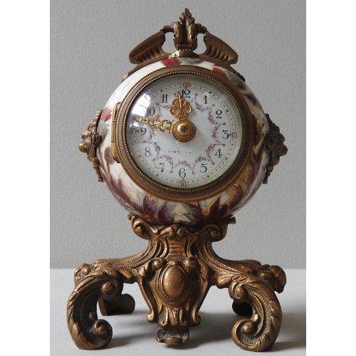 165 - A CERAMIC THISTLE PAINTED DESK CLOCK, of globular form with rococo style gilt metal mounts and base,... 