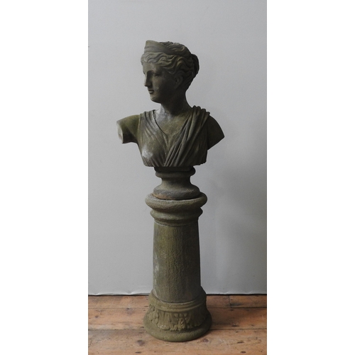 114 - A RECONSTITUTED STONE BUST OF GRECO ROMAN MAIDEN ON PILLAR, weathered appearance, the pillar splits ... 