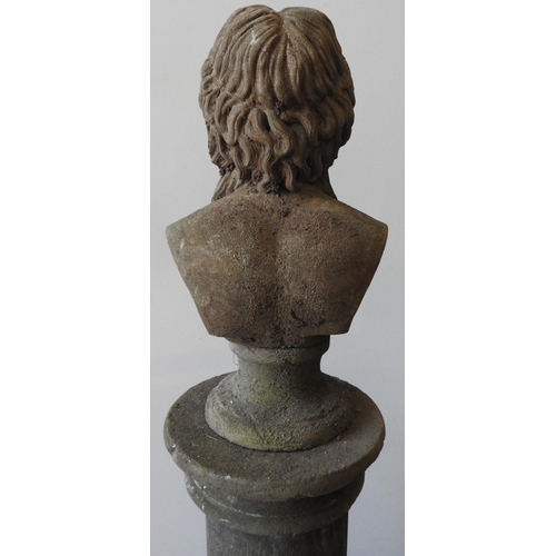 115 - A RECONSTITUTED STONE BUST OF ROMAN STYLE FIGURE ON PILLAR, weathered appearance, the roman style pi... 