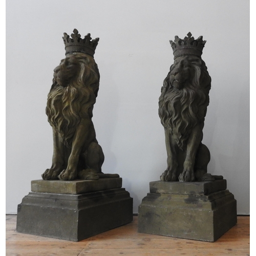 117 - A PAIR OF LARGE RECONSTITUTED STONE SEATED REGAL LION FIGURES, with removable crowns on plinths , we... 