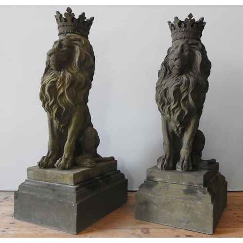 117 - A PAIR OF LARGE RECONSTITUTED STONE SEATED REGAL LION FIGURES, with removable crowns on plinths , we... 