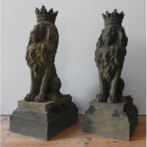 117 - A PAIR OF LARGE RECONSTITUTED STONE SEATED REGAL LION FIGURES, with removable crowns on plinths , we... 