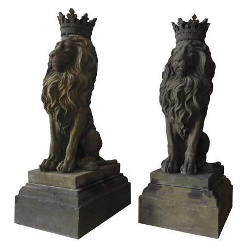 117 - A PAIR OF LARGE RECONSTITUTED STONE SEATED REGAL LION FIGURES, with removable crowns on plinths , we... 