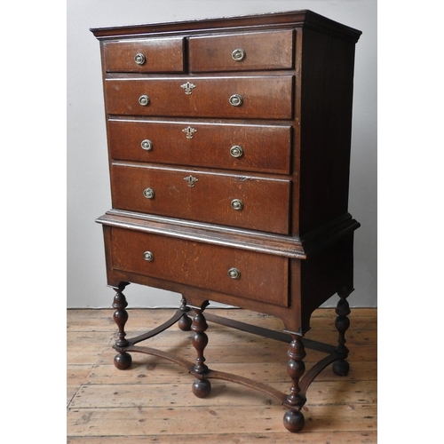 30 - A 19TH CENTURY OAK CHEST ON STAND, the crossbanded chest comprising of two short drawers over three ... 