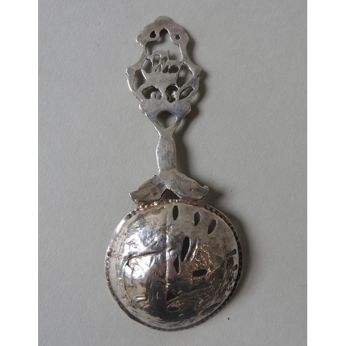 446 - AN EDWARDIAN ORNATE SILVER CADDY SPOON, with nautical themed repousse decoration, Chester 1908, made... 