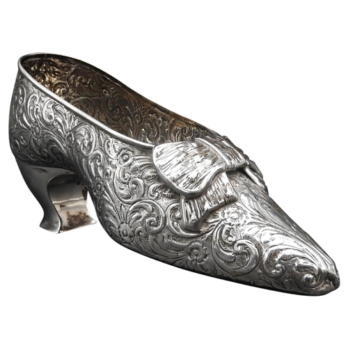 460 - A VICTORIAN SILVER SHOE ORNAMENT, with floral repousse decoration, by Nathan & Haynes, Chester 1... 