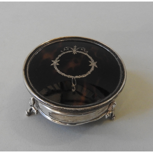 447 - A VINTAGE SILVER & TORTOISE SHELL RING BOX, the circular box with wreath & scroll decoration... 