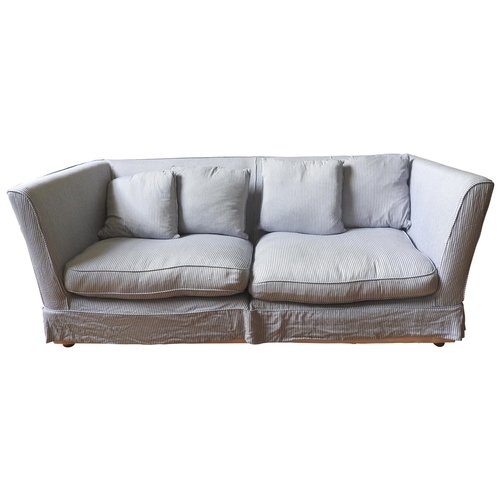 62 - A LARGE CONTEMPORARY THREE SEAT SOFA, with loose feather cushions, curved sides, splits into two sec... 