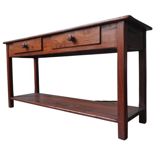 64 - A 20TH CENTURY INDONESIAN HARDWOOD HALL TABLE, of solid simplistic form, with two frieze drawers and... 