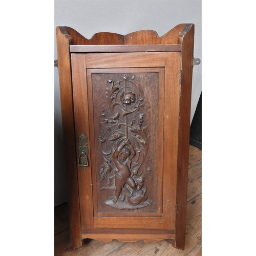 67 - A MAHOGANY ART NOUVEAU CARVED CORNER WALL CABINET AND A SIMILAR CABINET, the art nouveau cabinet car... 