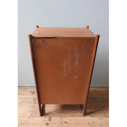 69 - A RETRO TEAK CHEST OF FIVE DRAWERS, circa 1970, with unusual circular split handles, supported on tw... 