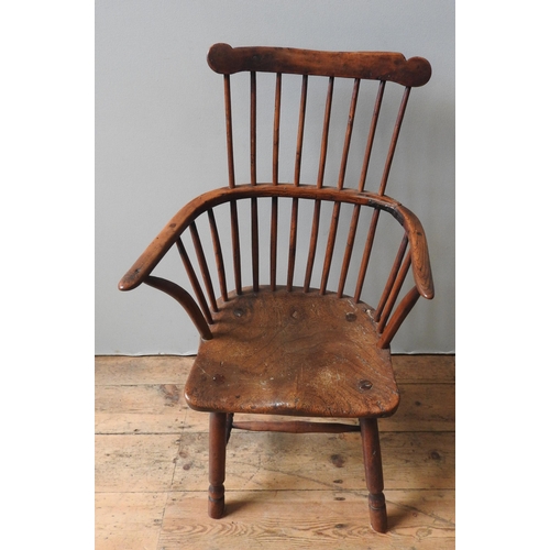 71 - A 18TH CENTURY YEW WOOD WINDSOR CHAIR, with elm saddle seat, on four turned legs united by stretcher... 