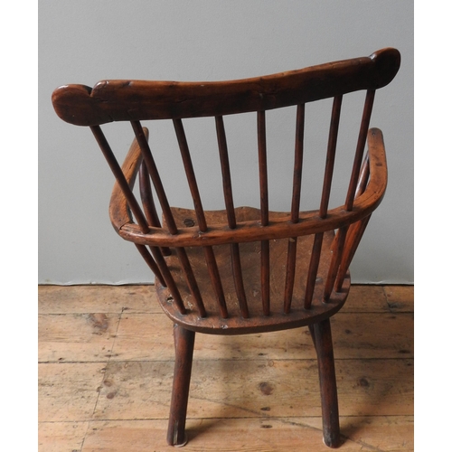 71 - A 18TH CENTURY YEW WOOD WINDSOR CHAIR, with elm saddle seat, on four turned legs united by stretcher... 