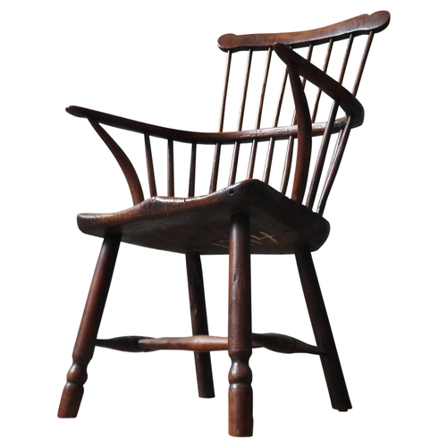 71 - A 18TH CENTURY YEW WOOD WINDSOR CHAIR, with elm saddle seat, on four turned legs united by stretcher... 