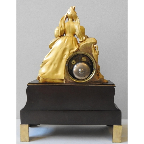 169 - A 19TH CENTURY GILT & PATINATED BRONZE MANTEL CLOCK, in the Directoire style, with an engine tur... 