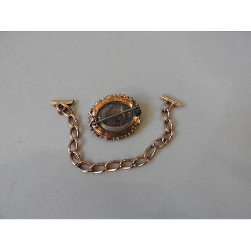 493 - A PIECE OF GOLD CURB CHAIN AND VICTORIAN LOCKETPossibly a safety chain.Weight 10gms.Length 15cm Mark... 