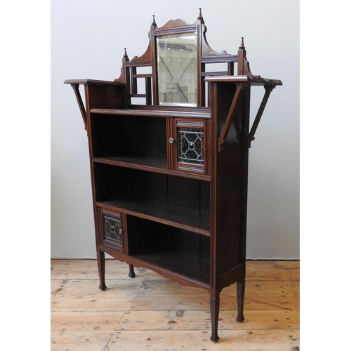 79 - A LATE 19TH CENTURY MAHOGANY FOUR TIER BOOKSHELF, in the Aesthetic style, with mirrored back top fla... 