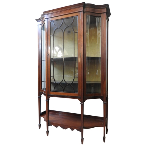 80 - A LATE 19TH CENTURY MAHOGANY INLAID BREAKFRONT VITRINE, with curved glass panels and two interior sh... 