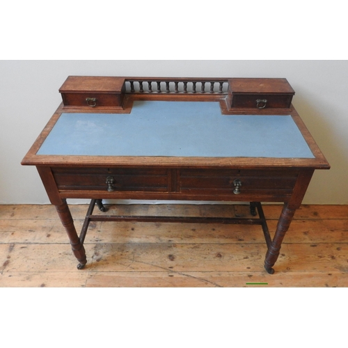 81 - A LATE 19TH CENTURY OAK WRITING TABLE, the leather top with two small drawers united by spindle back... 