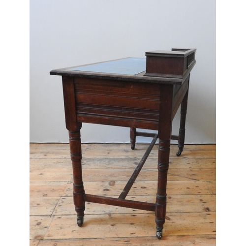 81 - A LATE 19TH CENTURY OAK WRITING TABLE, the leather top with two small drawers united by spindle back... 