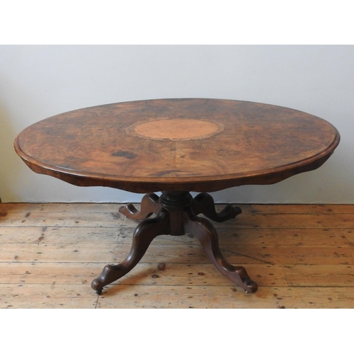 84 - A VICTORIAN WALNUT LOOE TABLE, the oval top inset with a central burr walnut panel, on a baluster pe... 