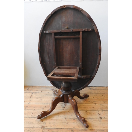 84 - A VICTORIAN WALNUT LOOE TABLE, the oval top inset with a central burr walnut panel, on a baluster pe... 