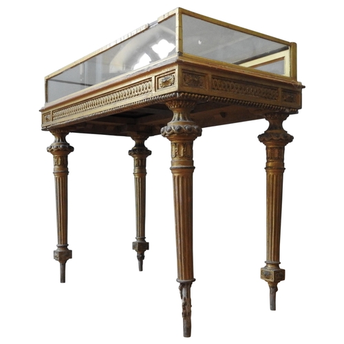 86 - A 19TH CENTURY GILT WOOD BIJOUTERIE, with plush lined interior, the frieze decorated with ornate int... 