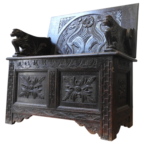 90 - A 19TH CENTURY CARVED OAK MONK'S BENCH, of small proportions, the ornate carved panels depicting gri... 