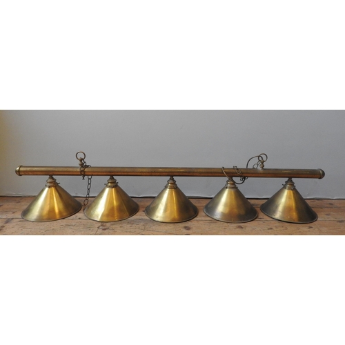 151 - A VINTAGE BRASS POOL TABLE LIGHT FITTING, consisting of five conical shades attached to a central br... 