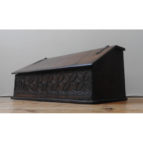 93 - AN 18TH CENTURY OAK DESK BOX, with iron hinges, the frieze panel carved with a repeating lozenge and... 