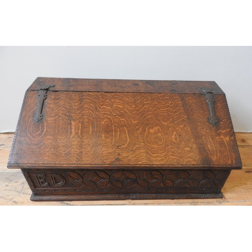 93 - AN 18TH CENTURY OAK DESK BOX, with iron hinges, the frieze panel carved with a repeating lozenge and... 