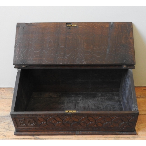 93 - AN 18TH CENTURY OAK DESK BOX, with iron hinges, the frieze panel carved with a repeating lozenge and... 