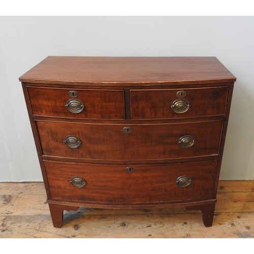 109 - A VICTORIAN MAHOGANY BOW FRONT CHEST OF FOUR DRAWERS, two short drawers over two long drawers on spl... 