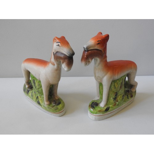 497 - A PAIR OF 20TH CENTURY STAFFORDSHIRE STYLE FLAT BACK FIGURES, depicting two hunting dogs retrieving ... 