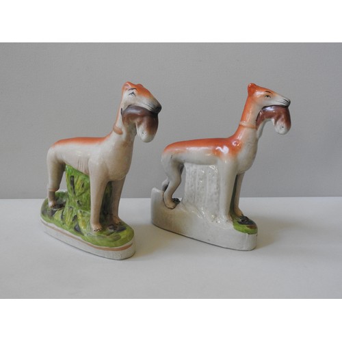 497 - A PAIR OF 20TH CENTURY STAFFORDSHIRE STYLE FLAT BACK FIGURES, depicting two hunting dogs retrieving ... 