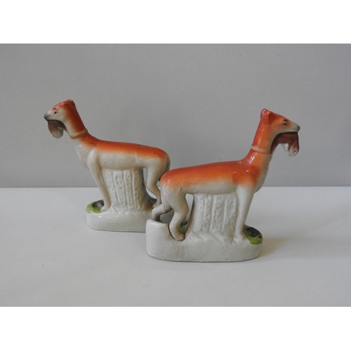 497 - A PAIR OF 20TH CENTURY STAFFORDSHIRE STYLE FLAT BACK FIGURES, depicting two hunting dogs retrieving ... 