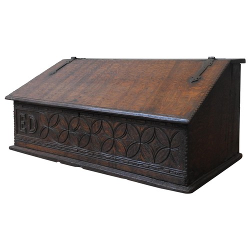 93 - AN 18TH CENTURY OAK DESK BOX, with iron hinges, the frieze panel carved with a repeating lozenge and... 