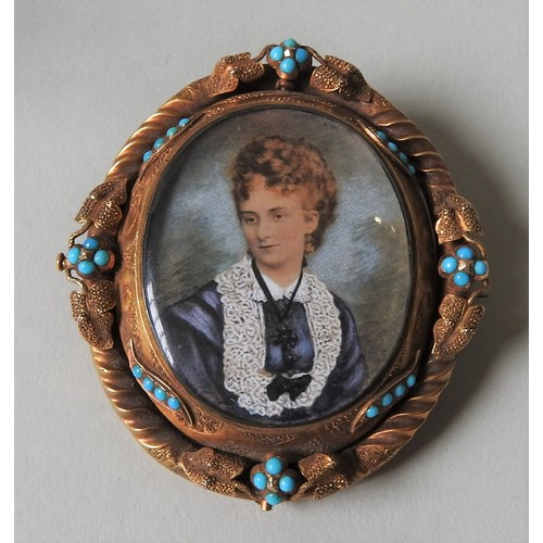 506 - A LATE VICTORIAN PORTRAIT BROOCH, the portrait picture mounted in an ornate oval pinchbeck brooch, w... 