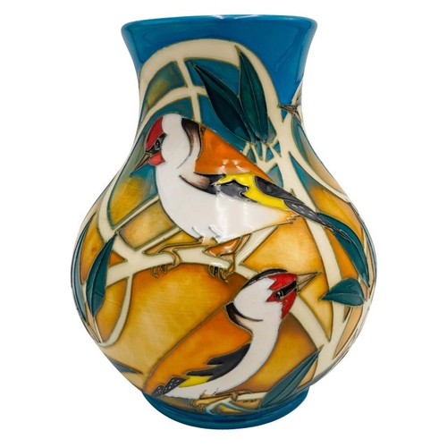 507 - A MODERN MOORCROFT VASE BY VICKY LOVATTdated 2011, no. 67/166, depicting finches and tits amongst fo... 