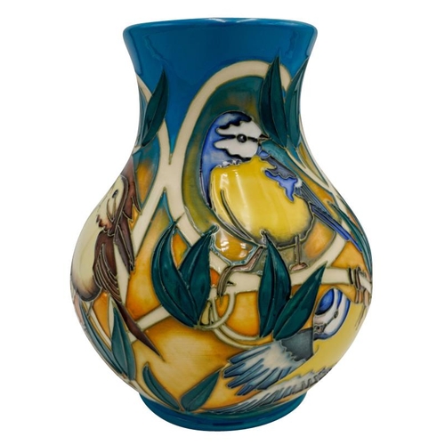 507 - A MODERN MOORCROFT VASE BY VICKY LOVATTdated 2011, no. 67/166, depicting finches and tits amongst fo... 