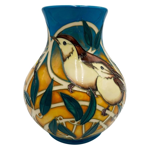 507 - A MODERN MOORCROFT VASE BY VICKY LOVATTdated 2011, no. 67/166, depicting finches and tits amongst fo... 