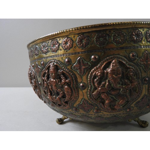 515 - INDIAN BRASS AND COPPER BOWL, decorated with a repeating frieze of deities including Ganesh, probabl... 